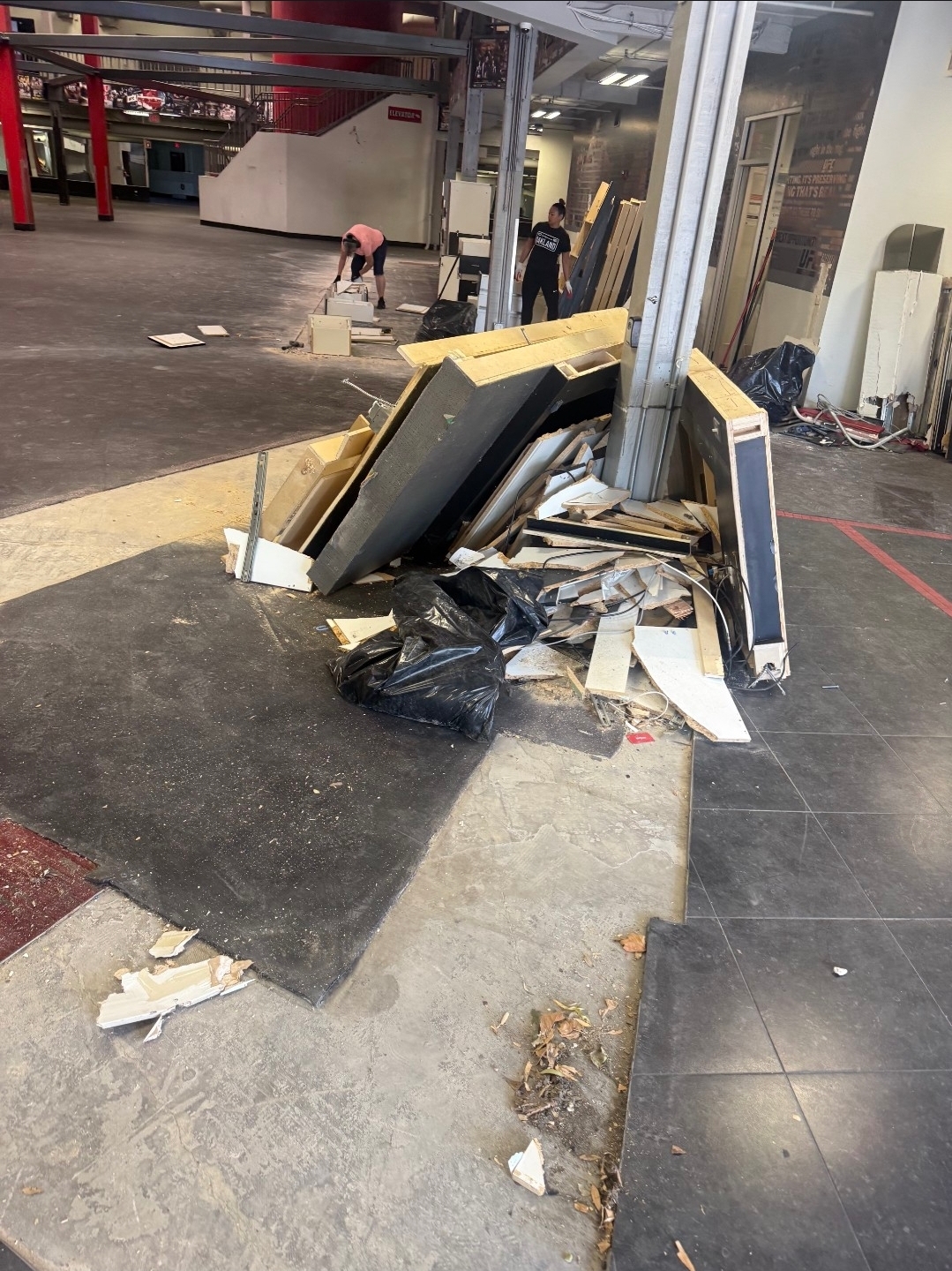 Commercial space before cleanout, full of debris and old fixtures