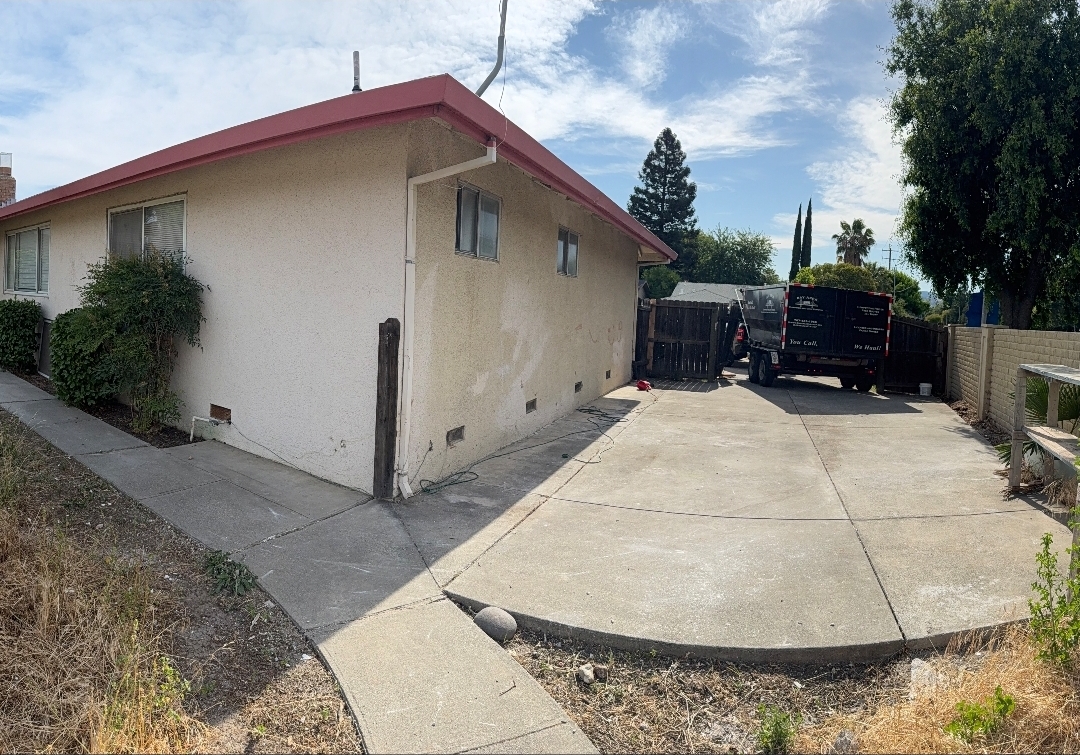 Same side yard after cleanout, clear driveway